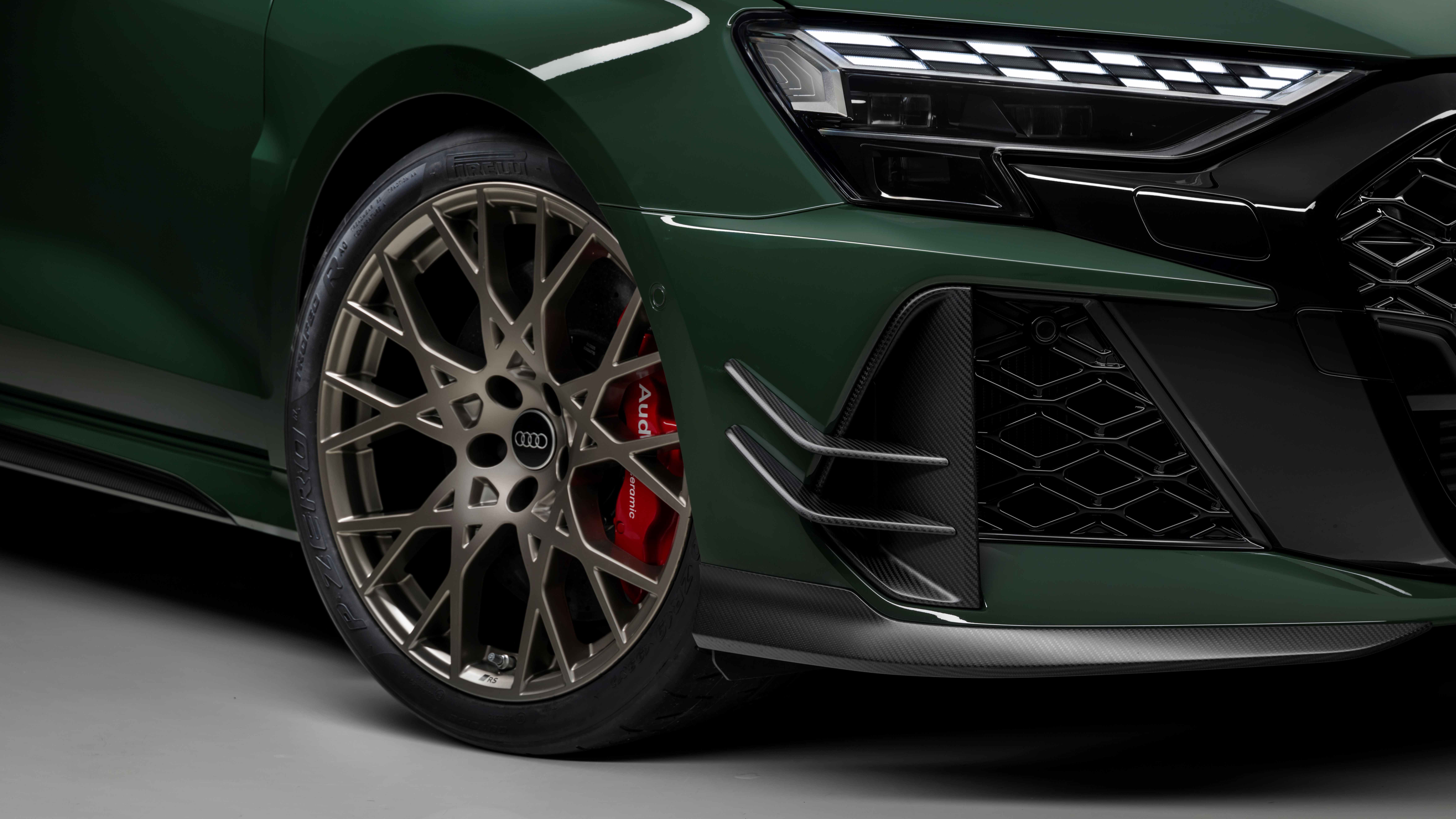 Close-up of the Audi RS 3 competition limited in Malachite Green, showing the Neodymium gold matte wheel and Pirelli P Zero R tyre with red Audi ceramic brakes. Photo Credit: Pirello